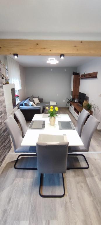 a living room with a table and chairs at Apartma Soča Oasis in Srpenica
