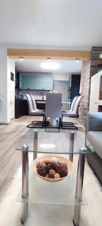 a plate of food on a glass table in a room at Apartma Soča Oasis in Srpenica