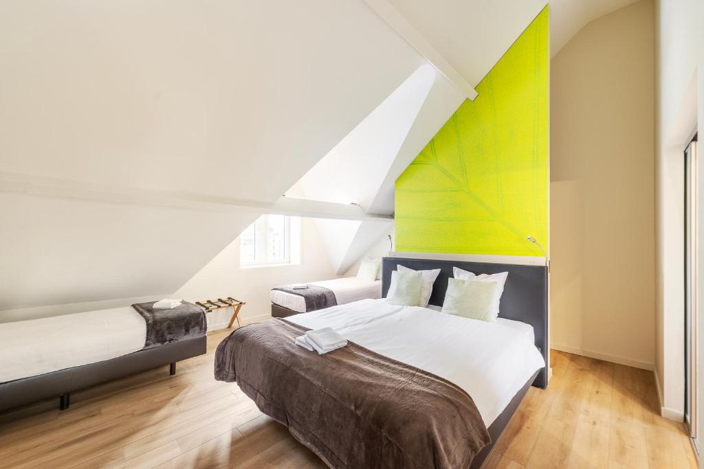Postel nebo postele na pokoji v ubytování Hotel Het Menneke