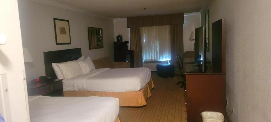 Een bed of bedden in een kamer bij The Arc Hotel
