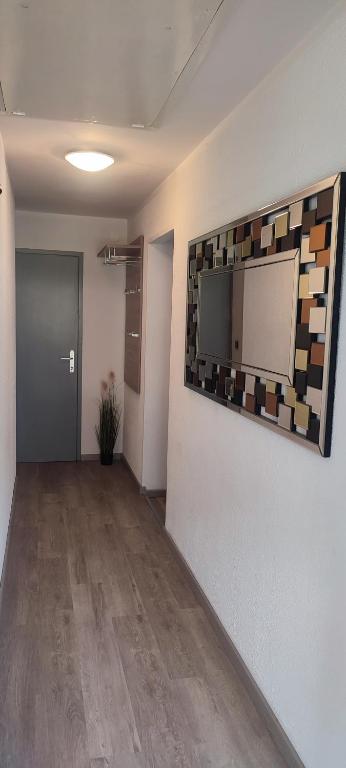 an empty room with a flat screen tv on a wall at Apartma Soča Oasis in Srpenica