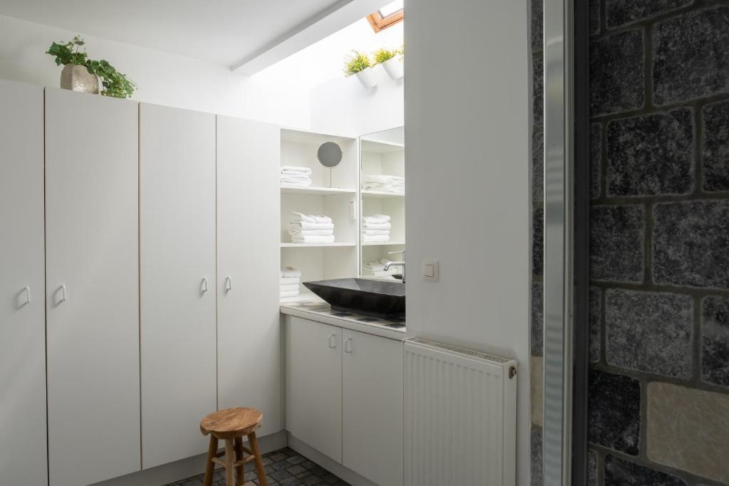 Kuchyň nebo kuchyňský kout v ubytování B&B De Joker
