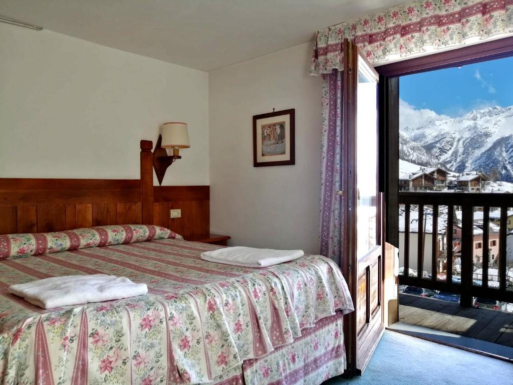 Postel nebo postele na pokoji v ubytování Hotel Locanda Grauson