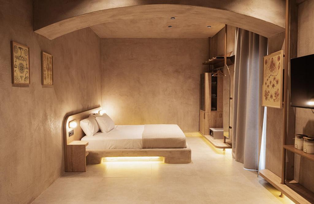 Giường trong phòng chung tại Medusa Luxury Suites