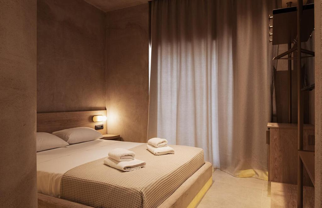 Łóżko lub łóżka w pokoju w obiekcie Medusa Luxury Suites