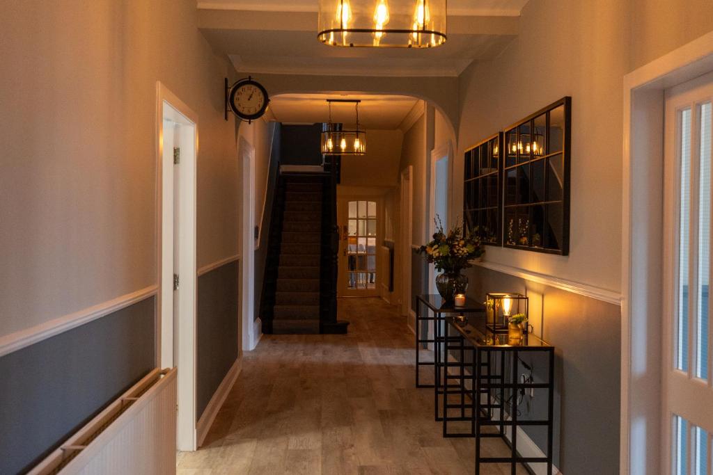 a hallway of a home with a clock on the ceiling at The Crossing Bed and Breakfast in Kingussie