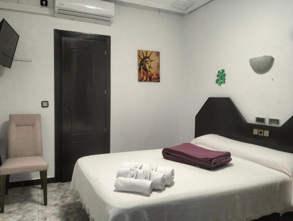 Postel nebo postele na pokoji v ubytování Hostal New York City