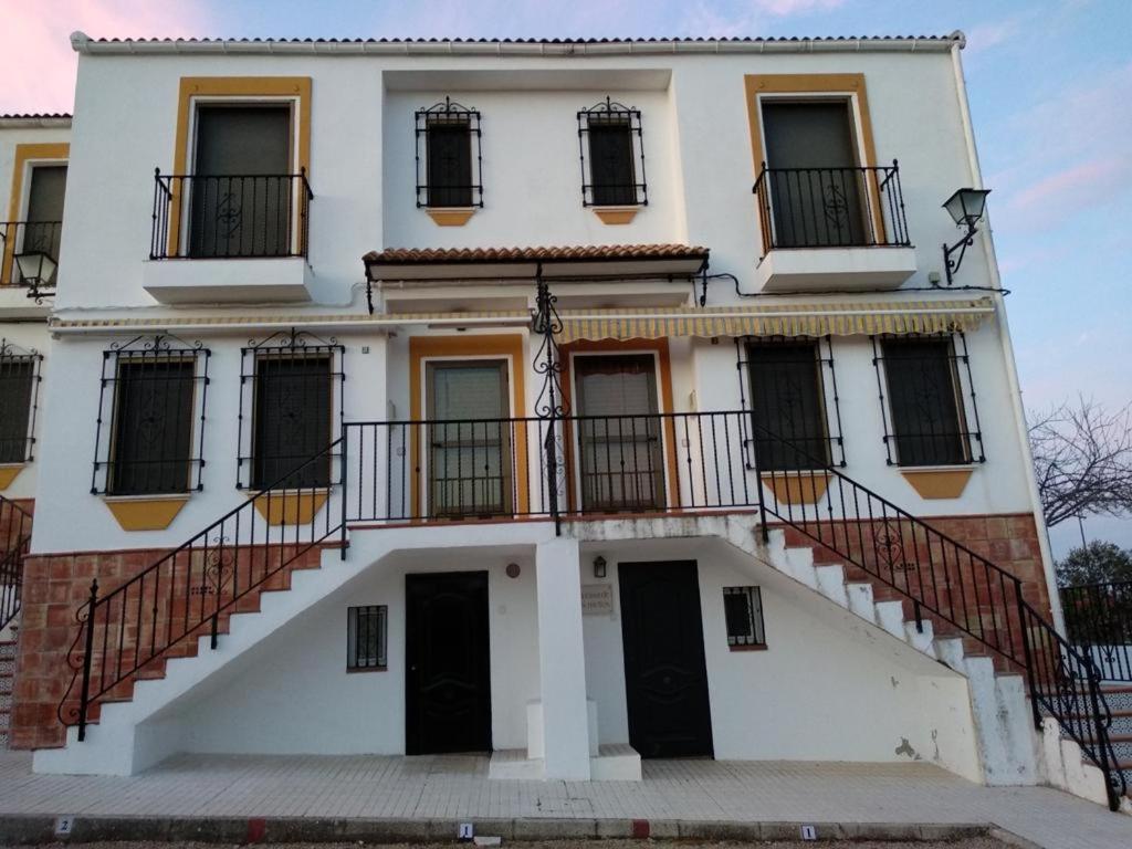 a white building with a staircase in front of it at VFT DOÑA ELVIRA SIERRA in Virgen de la Cabeza
