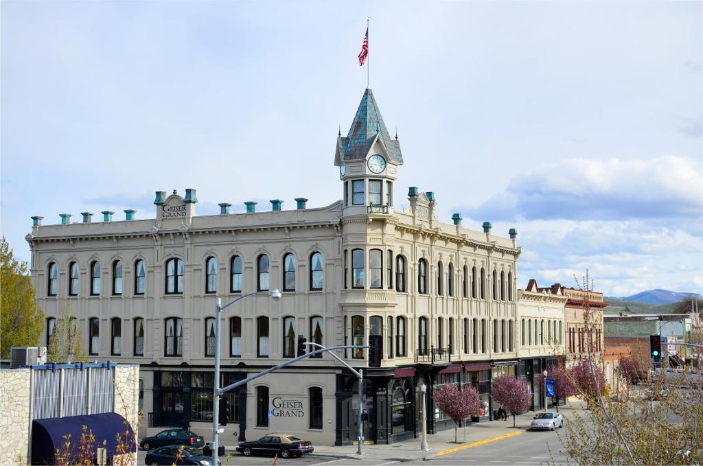 a large building with a clock tower on top of it at Geiser Grand Hotel in Baker City