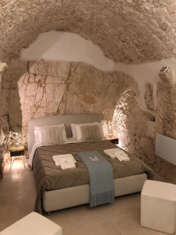 Postel nebo postele na pokoji v ubytování Cà sotto l’arco