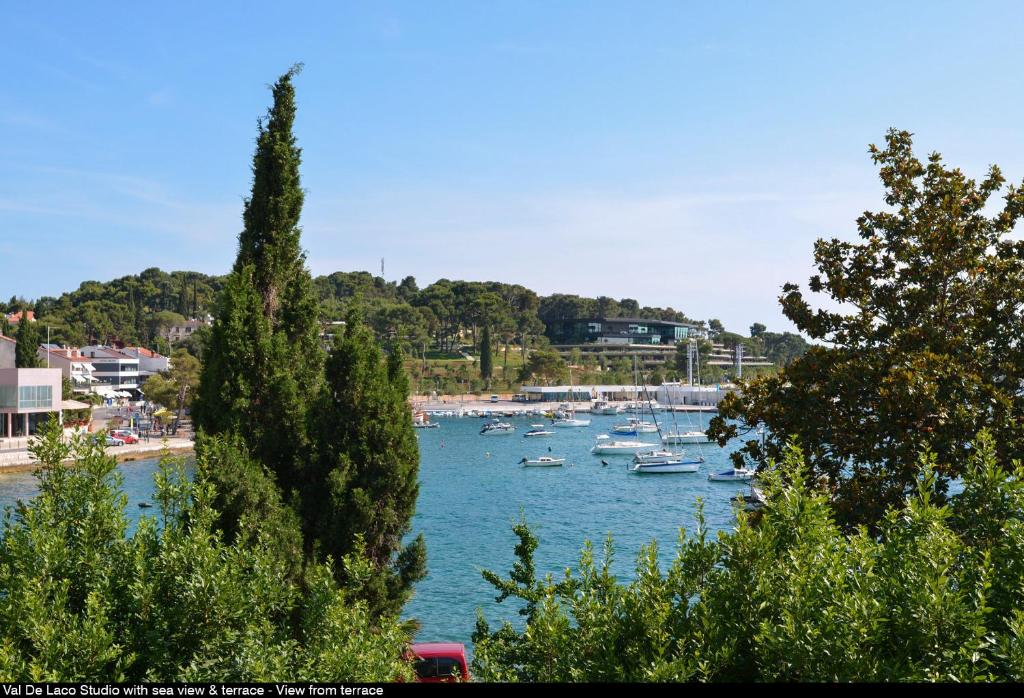 a group of boats are docked in a harbor at Val De Laco studio apartments in Rovinj