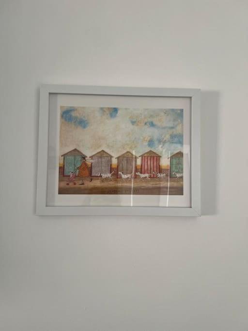 a picture of a painting of a row of houses at Annie's Hideaway in Chapel Saint Leonards