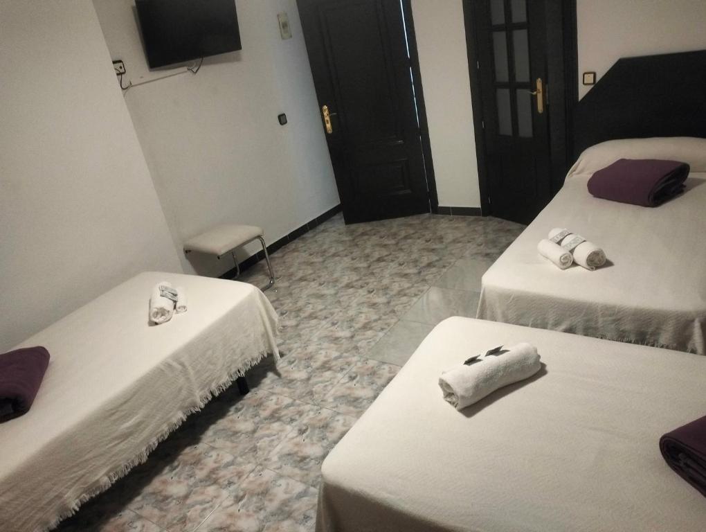 Postel nebo postele na pokoji v ubytování Hostal New York City