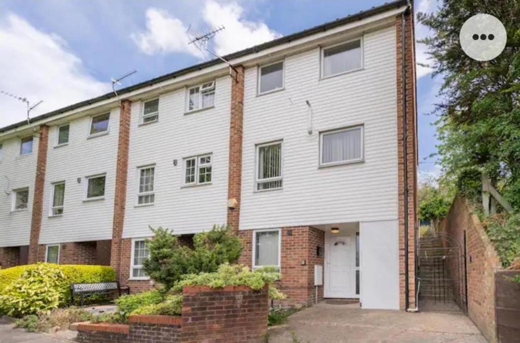 a large white building with a brick at Chatham Three Bedroom in Chatham