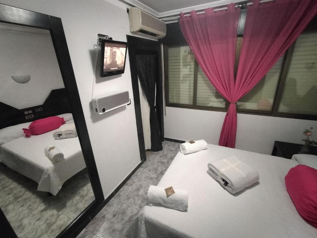 Postel nebo postele na pokoji v ubytování Hostal New York City
