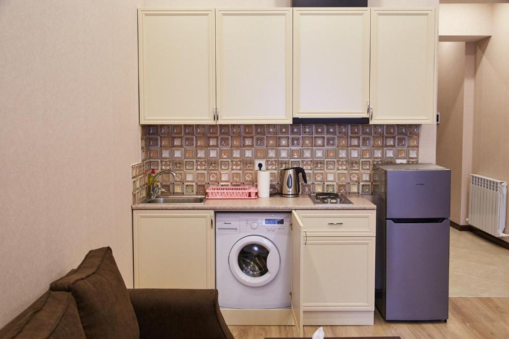 a kitchen with a washing machine and a washer at Residence North Avenue, Teryan 8. 14 2 in Yerevan