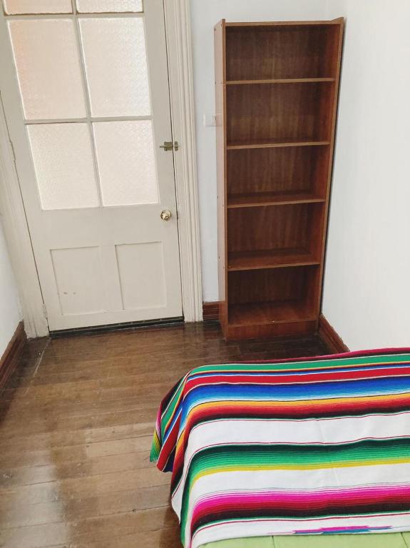 Postel nebo postele na pokoji v ubytování Hostal Tulio Porteño