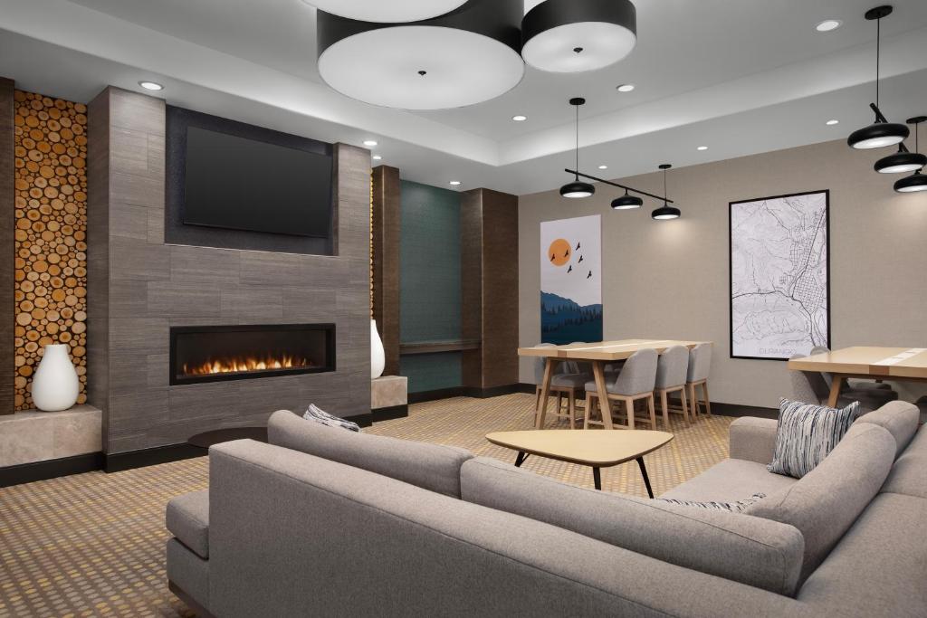 a living room with couches and a fireplace at Holiday Inn & Suites Durango Downtown by IHG in Durango