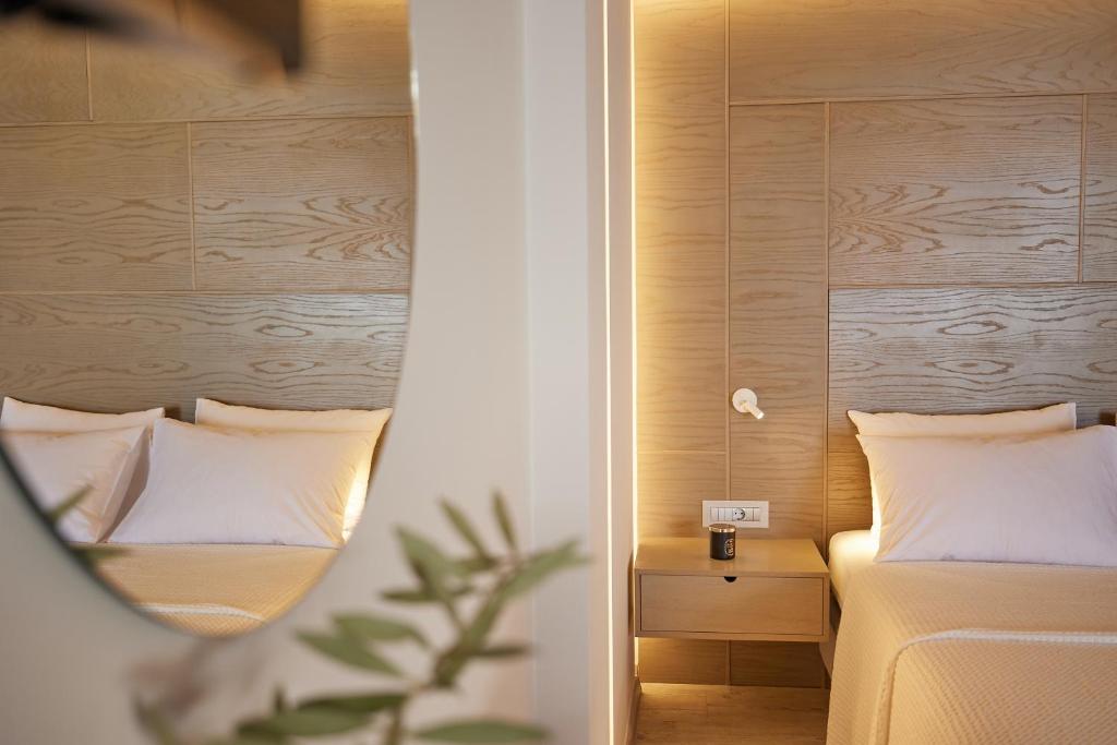 Кровать или кровати в номере CICADA HOTEL