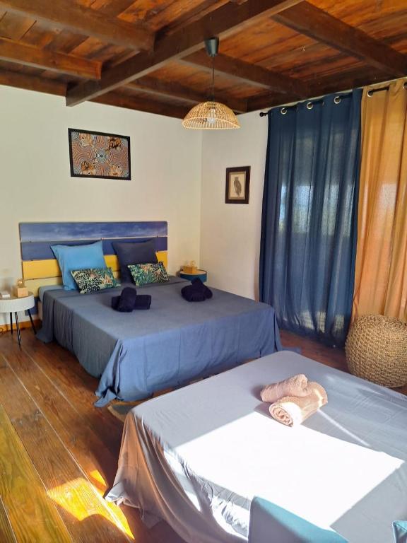 Postelja oz. postelje v sobi nastanitve SofPat Plage Raiatea