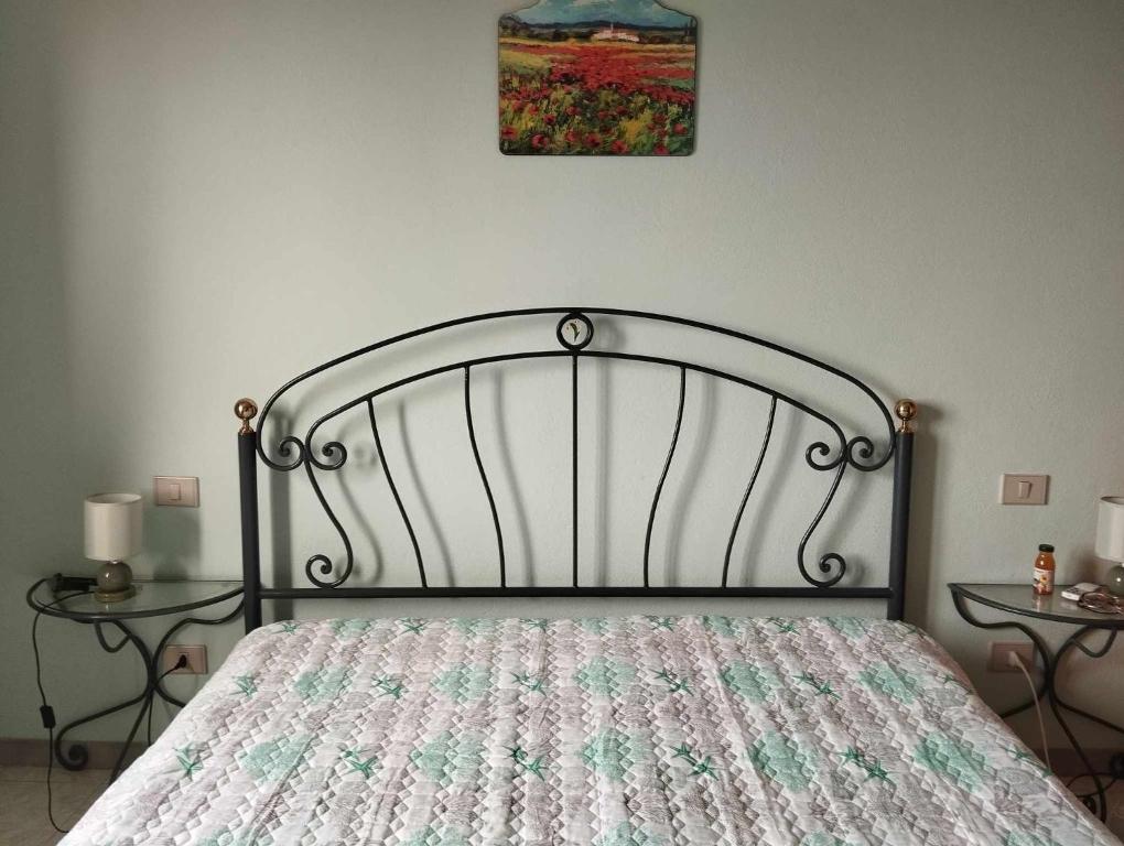 En eller flere senge i et værelse på Holiday home Riccio di Mare Sardinia