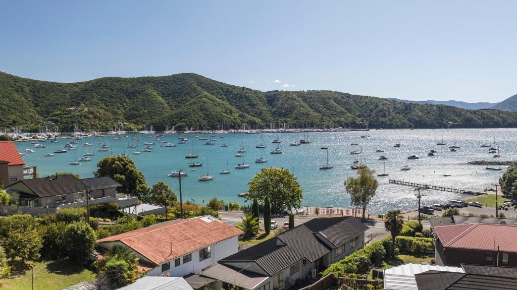 a view of a harbor with boats in the water at Finlay Waterfront - Waikawa Holiday Home in Picton