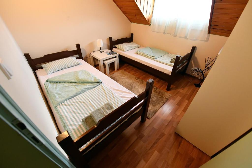 Postel nebo postele na pokoji v ubytování Smeštaj SIMOVIĆ