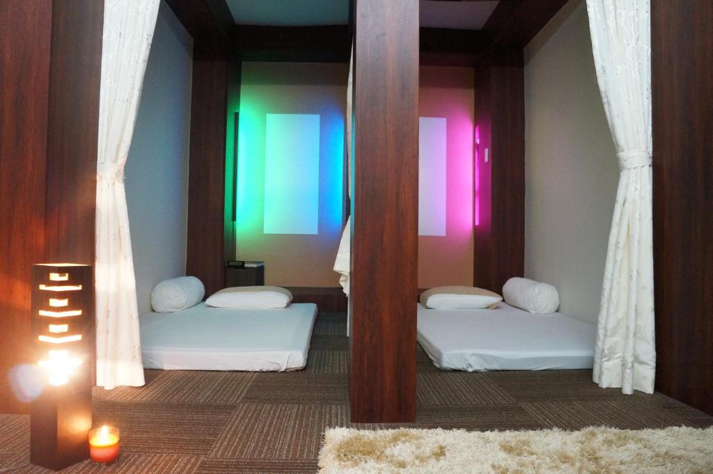 Postel nebo postele na pokoji v ubytování Capsule Hotel 310