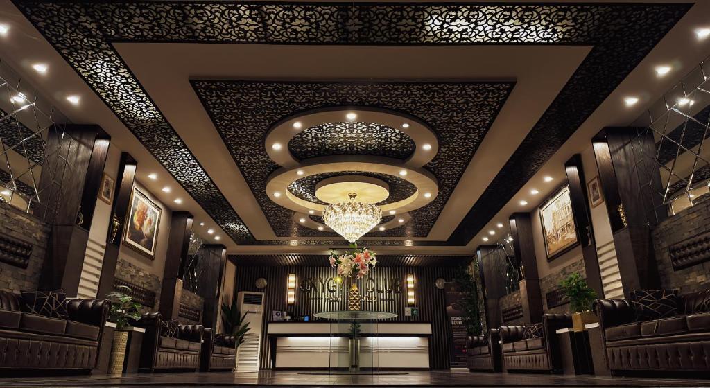 a rendering of a synagogue with a chandelier at Oxygym Hotel Faisalabad in Faisalabad
