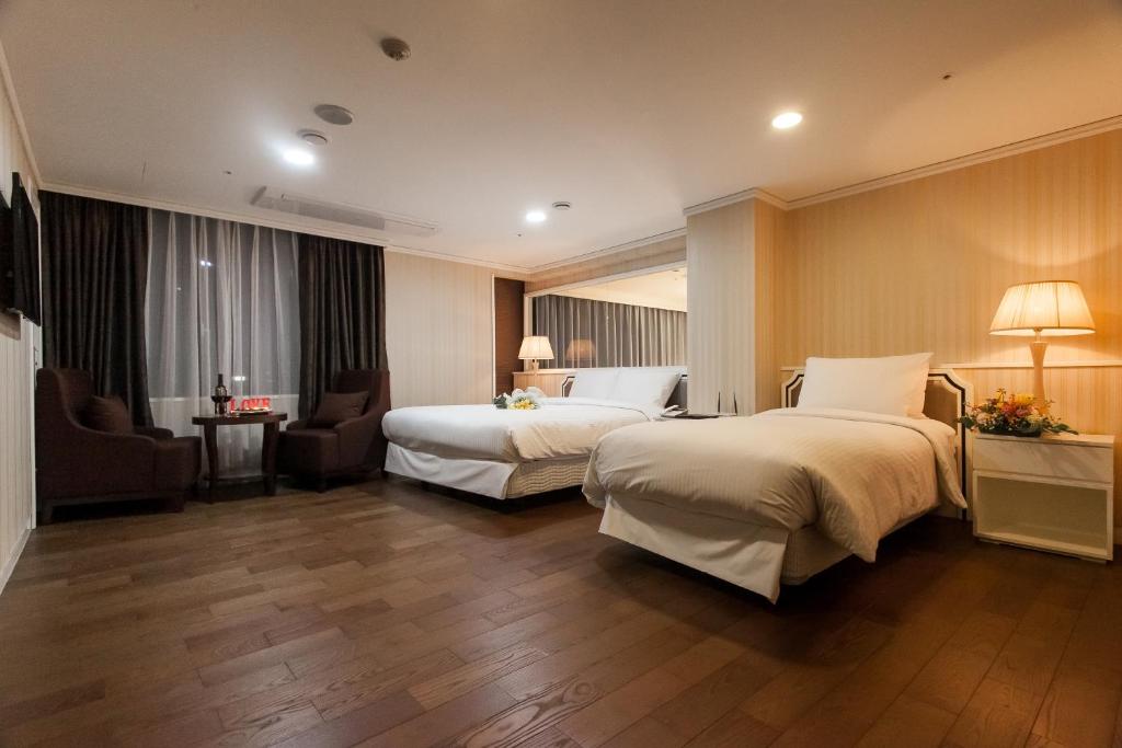 Postel nebo postele na pokoji v ubytování Hotel Pharos