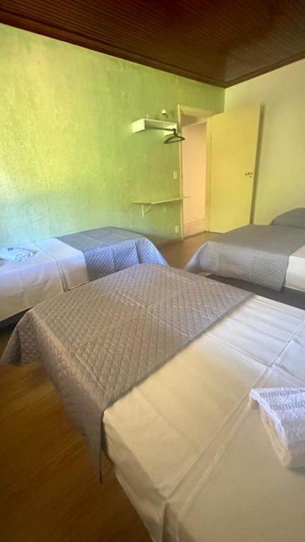 Postel nebo postele na pokoji v ubytování Sossego e Fé