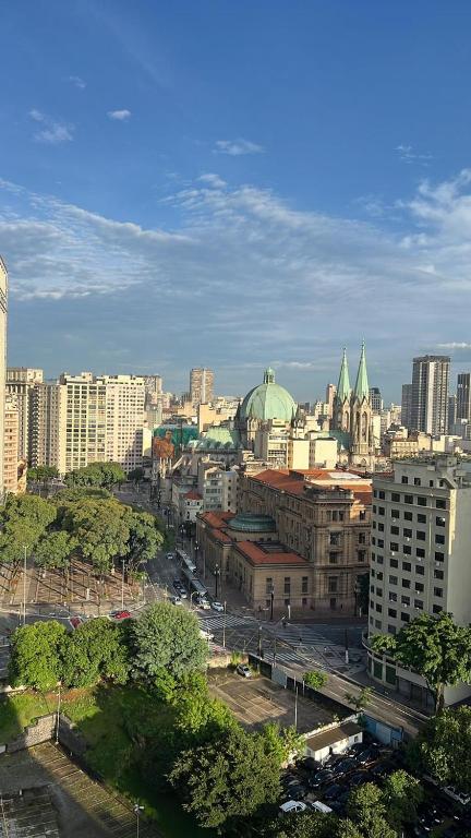 a view of a city with buildings and trees at Studio Liberdade in São Paulo