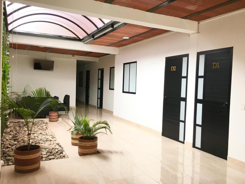 an empty lobby with plants and a ceiling at Daresff Imperial in Puerto Wilches