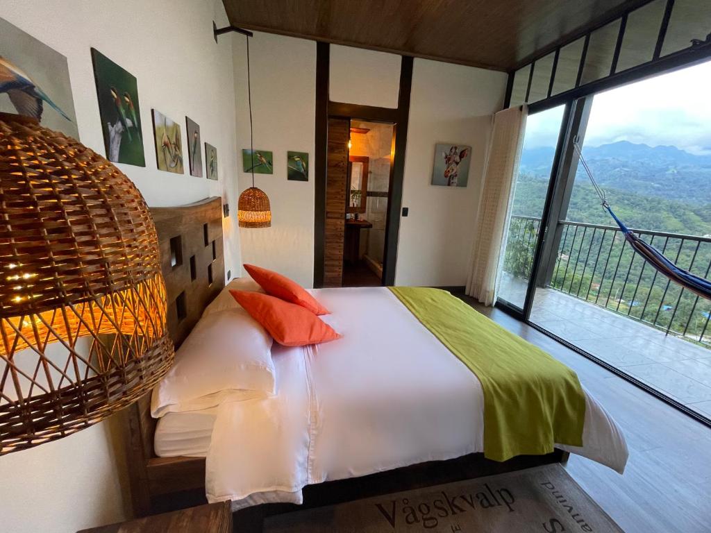 A bed or beds in a room at Natubri Ecohotel Habitacion VIP