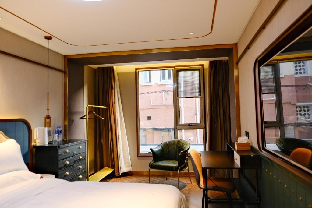 Postel nebo postele na pokoji v ubytování Xinyu Hotel - Shanghai Jiao Tong University Xinhua Road