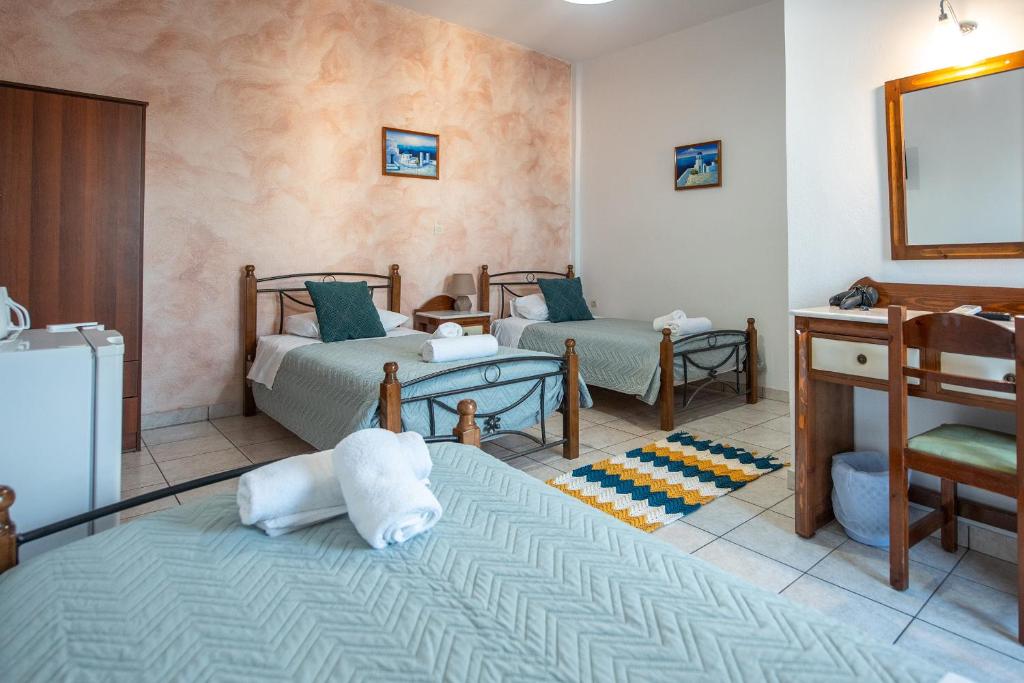 Łóżko lub łóżka w pokoju w obiekcie Pension Stella