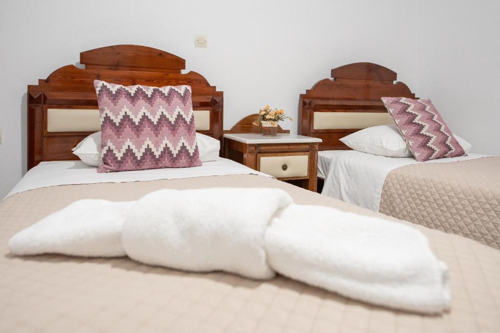 Łóżko lub łóżka w pokoju w obiekcie Pension Stella
