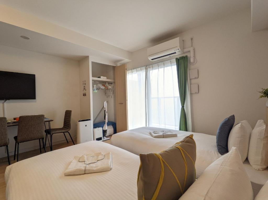 Postel nebo postele na pokoji v ubytování ESLEAD HOTEL Namba South Ⅰ