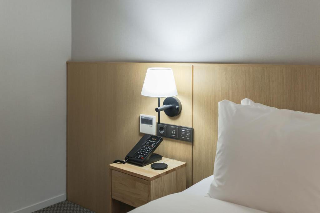 Postel nebo postele na pokoji v ubytování Aank Hotel Incheon Guwol