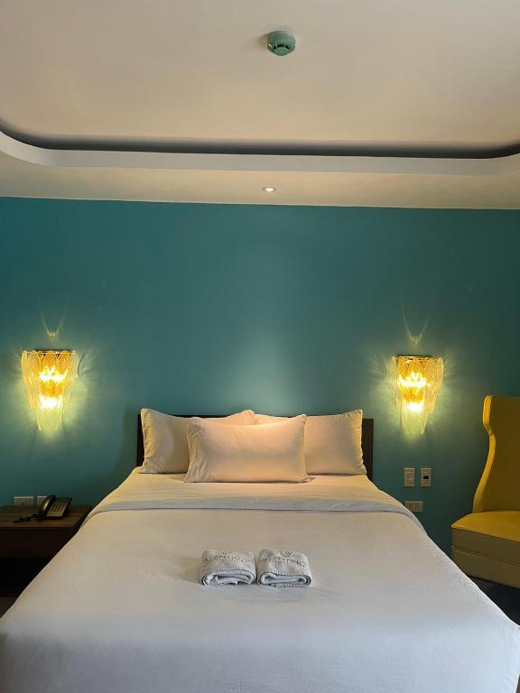Postel nebo postele na pokoji v ubytování Valentino's Hotel