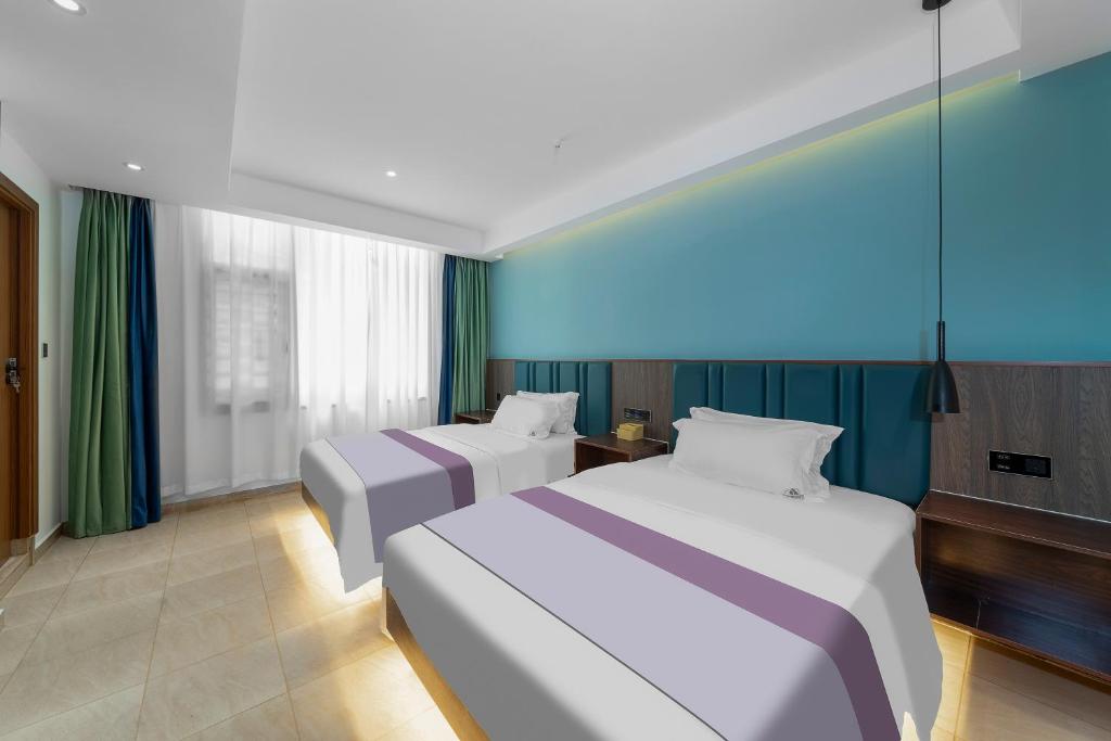 Postel nebo postele na pokoji v ubytování Phoenix Best River View B&B 故里明月