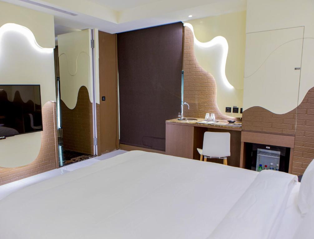 Postel nebo postele na pokoji v ubytování All-Ur Boutique Motel - Xinzhuang Branch