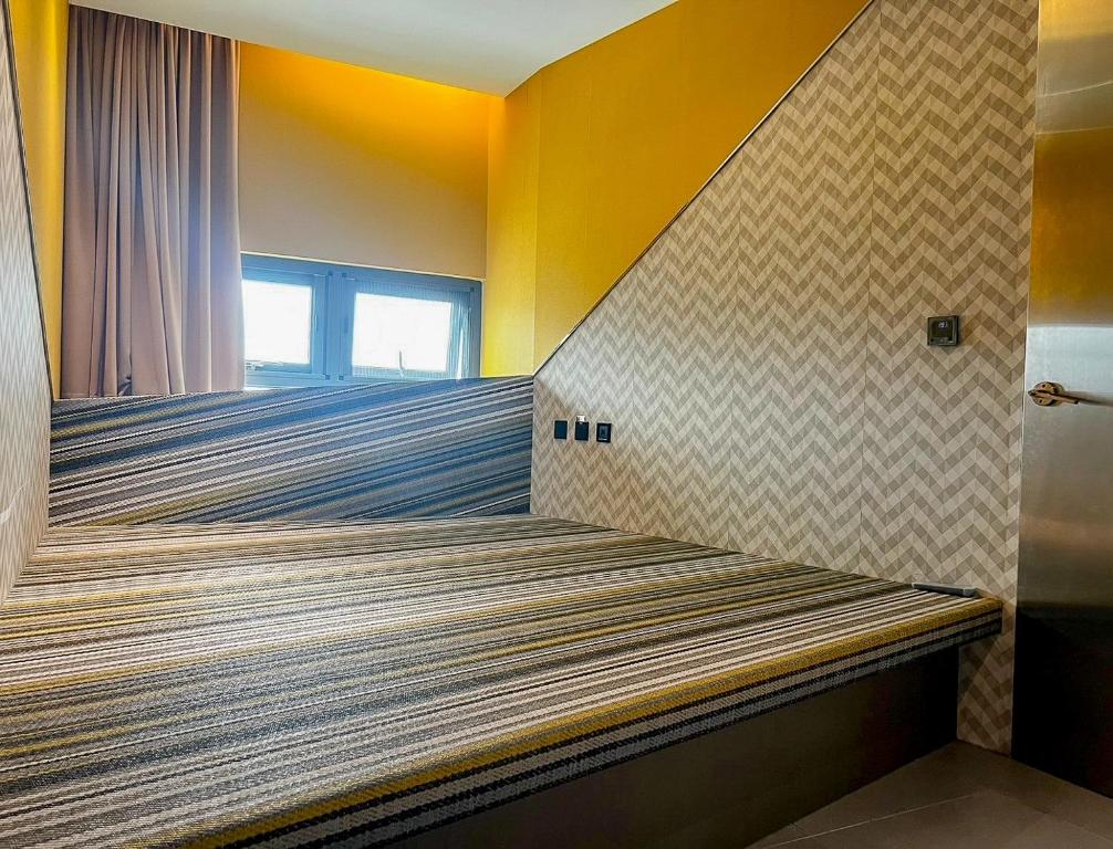 Postel nebo postele na pokoji v ubytování All-Ur Boutique Motel - Xinzhuang Branch