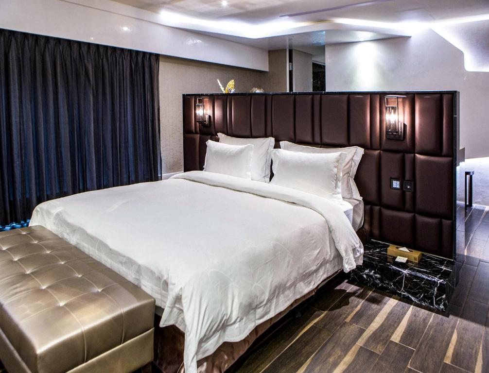 Postel nebo postele na pokoji v ubytování All-Ur Boutique Motel - Xinzhuang Branch