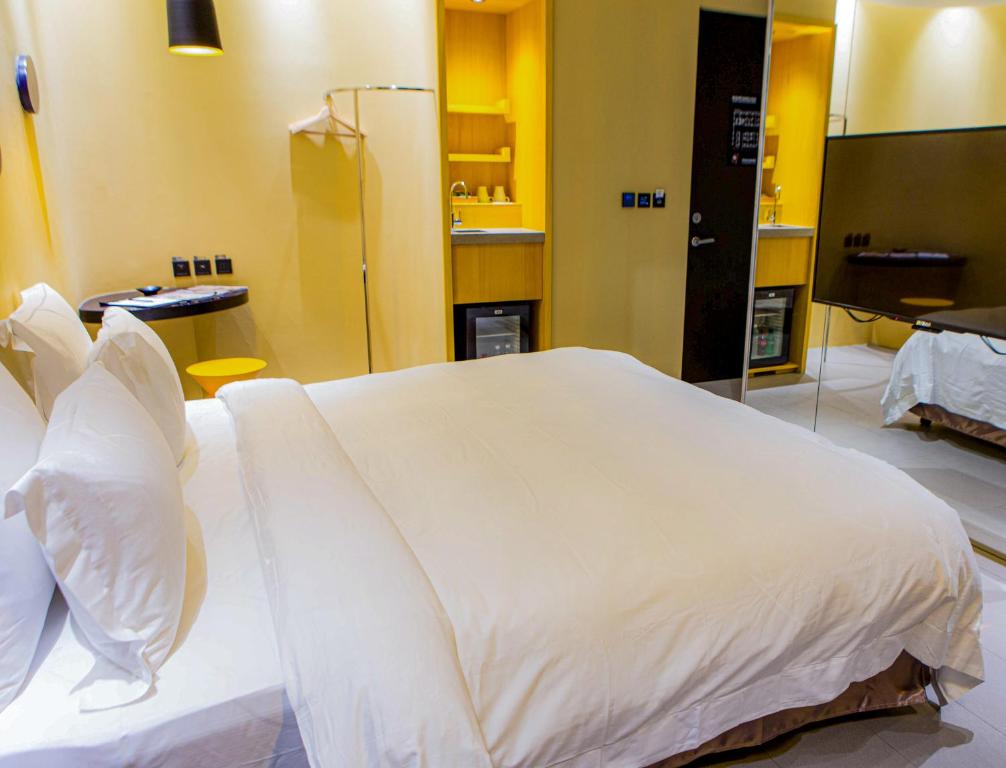 Postel nebo postele na pokoji v ubytování All-Ur Boutique Motel - Xinzhuang Branch