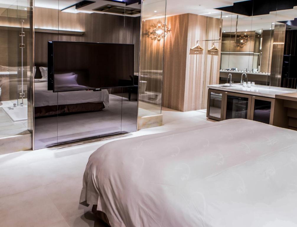Postel nebo postele na pokoji v ubytování All-Ur Boutique Motel - Xinzhuang Branch