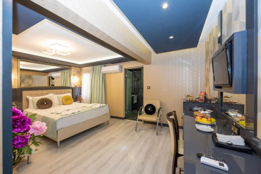 Postel nebo postele na pokoji v ubytování Grand Ons Hotel