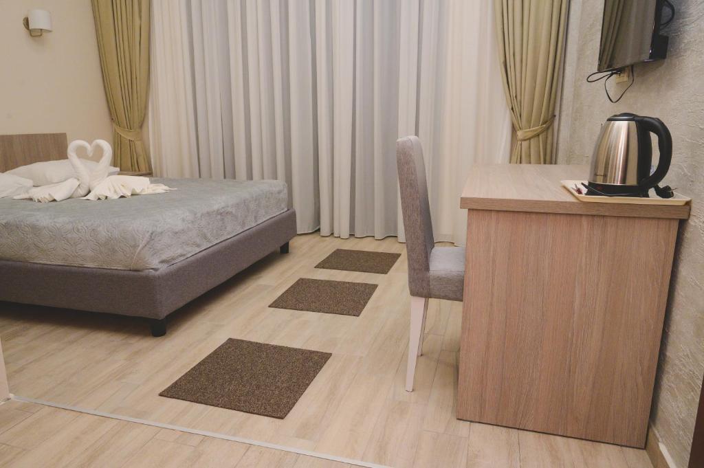 Postel nebo postele na pokoji v ubytování IPN ROOMs