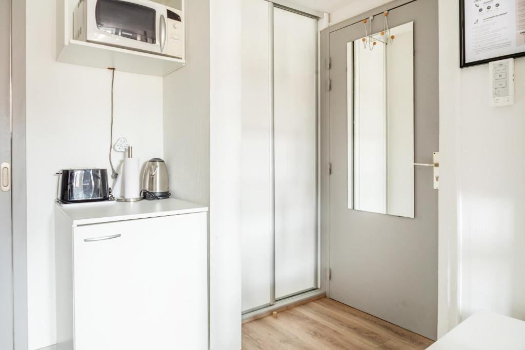 Kuchyň nebo kuchyňský kout v ubytování StuDio 11 - Centre-ville - Cozy
