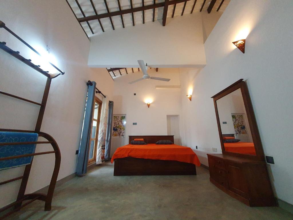 Postel nebo postele na pokoji v ubytování Mirissa Surf Villa